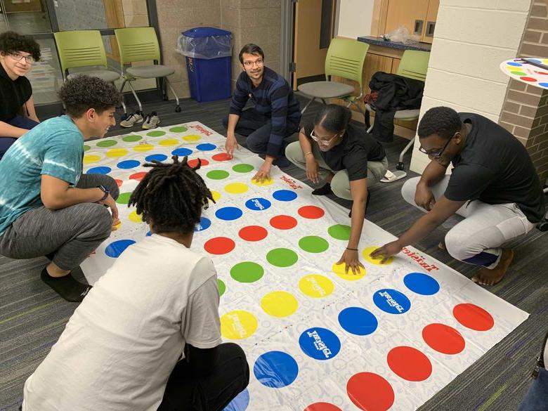Student playing Twister in Lions Gate