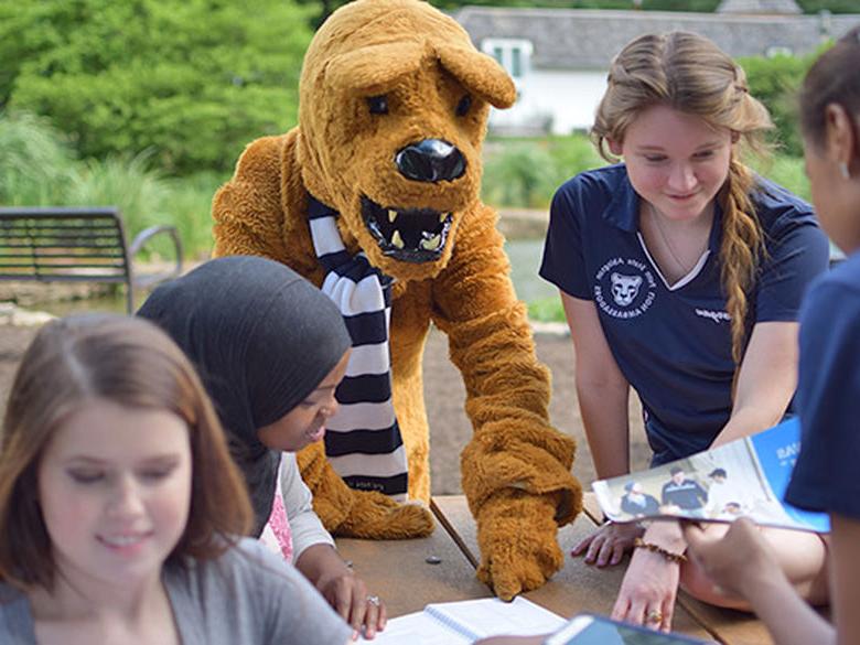 Lion helping students at the pond